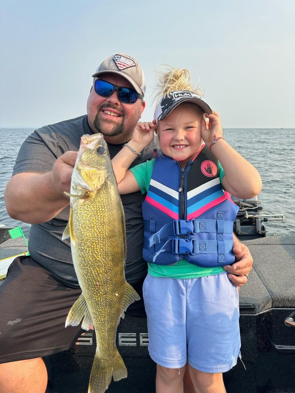 Tim Wollak and his daughter Henley catch game fish on Lake Michigan. Their shared hobby led to their discovery of a long-lost shipwreck that's more than 150 years old.