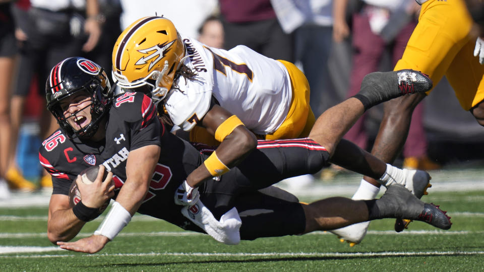 Arizona State defensive back Shamari Simmons (7) tackles Utah quarterback Bryson Barnes (16) during the first half of an NCAA college football game Saturday, Nov. 4, 2023, in Salt Lake City. (AP Photo/Rick Bowmer)