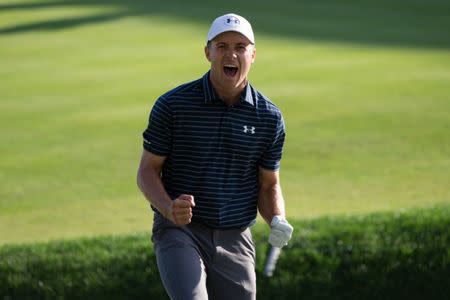 Jun 25, 2017; Cromwell, CT, USA; Jordan Spieth reacts after chipping out of the sand for a birdie during the first playoff hole of the final round of the Travelers Championship golf tournament at TPC River Highlands. Bill Streicher-USA TODAY Sports