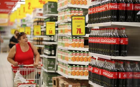 Supermarket shelves are a marketing exercise for big brands. But as online shopping rises, consumer giants are having to find new ways to be retain loyal customers - Credit: Andrey Rudakov/Bloomberg