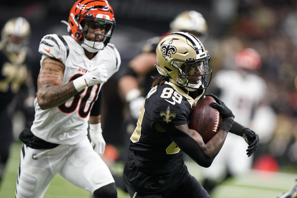 New Orleans Saints wide receiver Rashid Shaheed (89) runs past Cincinnati Bengals' Mike Thomas (80) for a touchdown during the first half of an NFL football game in New Orleans, Sunday, Oct. 16, 2022. (AP Photo/Gerald Herbert)