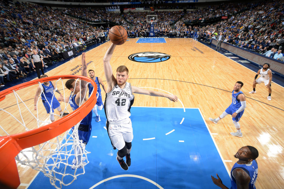 DALLAS, TX - MARCH 12: Davis Bertans #42 of the San Antonio Spurs dunks the ball against the Dallas Mavericks on March 12, 2019 at the American Airlines Center in Dallas, Texas. NOTE TO USER: User expressly acknowledges and agrees that, by downloading and/or using this photograph, user is consenting to the terms and conditions of the Getty Images License Agreement. Mandatory Copyright Notice: Copyright 2019 NBAE (Photo by Glenn James/NBAE via Getty Images)