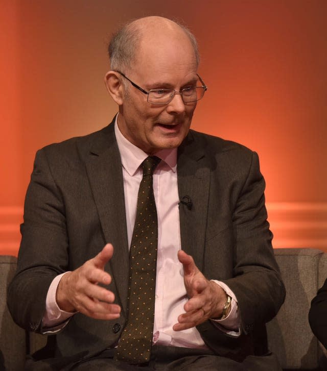 Professor Sir John Curtice in a suit