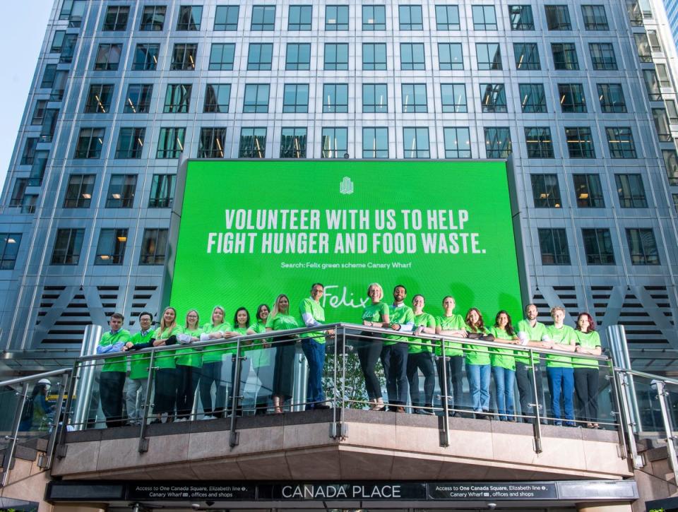 Shobi Khan and Charlotte Hill pictured with The Felix Project volunteers at Canary Wharf (Lucy Young)