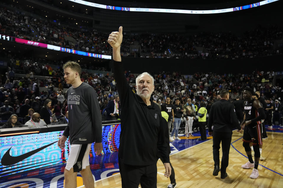 San Antonio Spurs head coach Gregg Popovich flashes a thumb up after losing to the Miami Heat at the end of an NBA basketball game, at the Mexico Arena in Mexico City, Saturday, Dec. 17, 2022. The Heat won 111-101. (AP Photo/Fernando Llano)