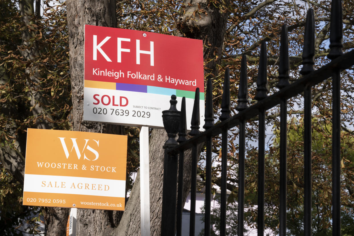 Estate agent signs for 'Kinleigh Folkard & Hayward' and 'Wooster & Stock' stand outisde period residential homes in a south London street, on 6th October 2022, in London, England. (Photo by Richard Baker / In Pictures via Getty Images)