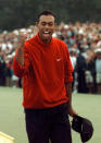 <p>1997 Masters champion Tiger Woods celebrates as he leaves the 18th green after winning the Masters at the Augusta National Golf Club in Augusta, Ga., Sunday, April 13, 1997. (AP Photo/ Dave Martin) </p>