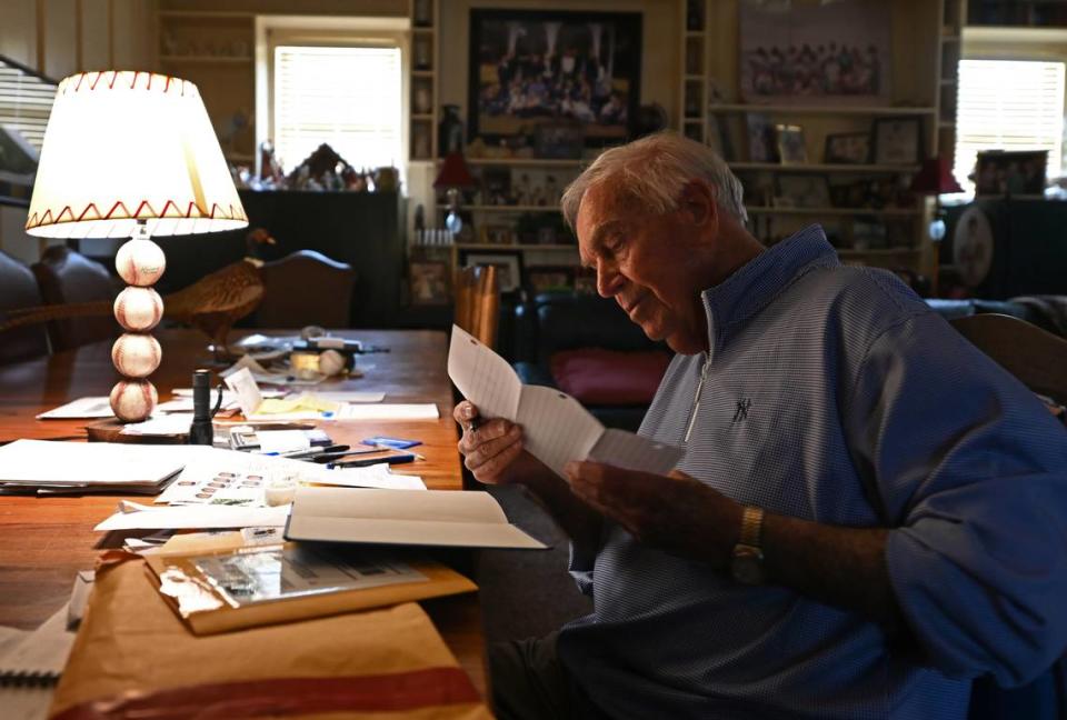 Former New York Yankees second baseman Bobby Richardson looks over one of the fan letters he received at his home in Sumter, S.C.