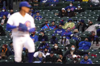 Fans are bundled up in the cold weather as they watch a baseball game between the Los Angeles Dodgers and the Chicago Cubs in Chicago, Wednesday, May 5, 2021. (AP Photo/Nam Y. Huh)
