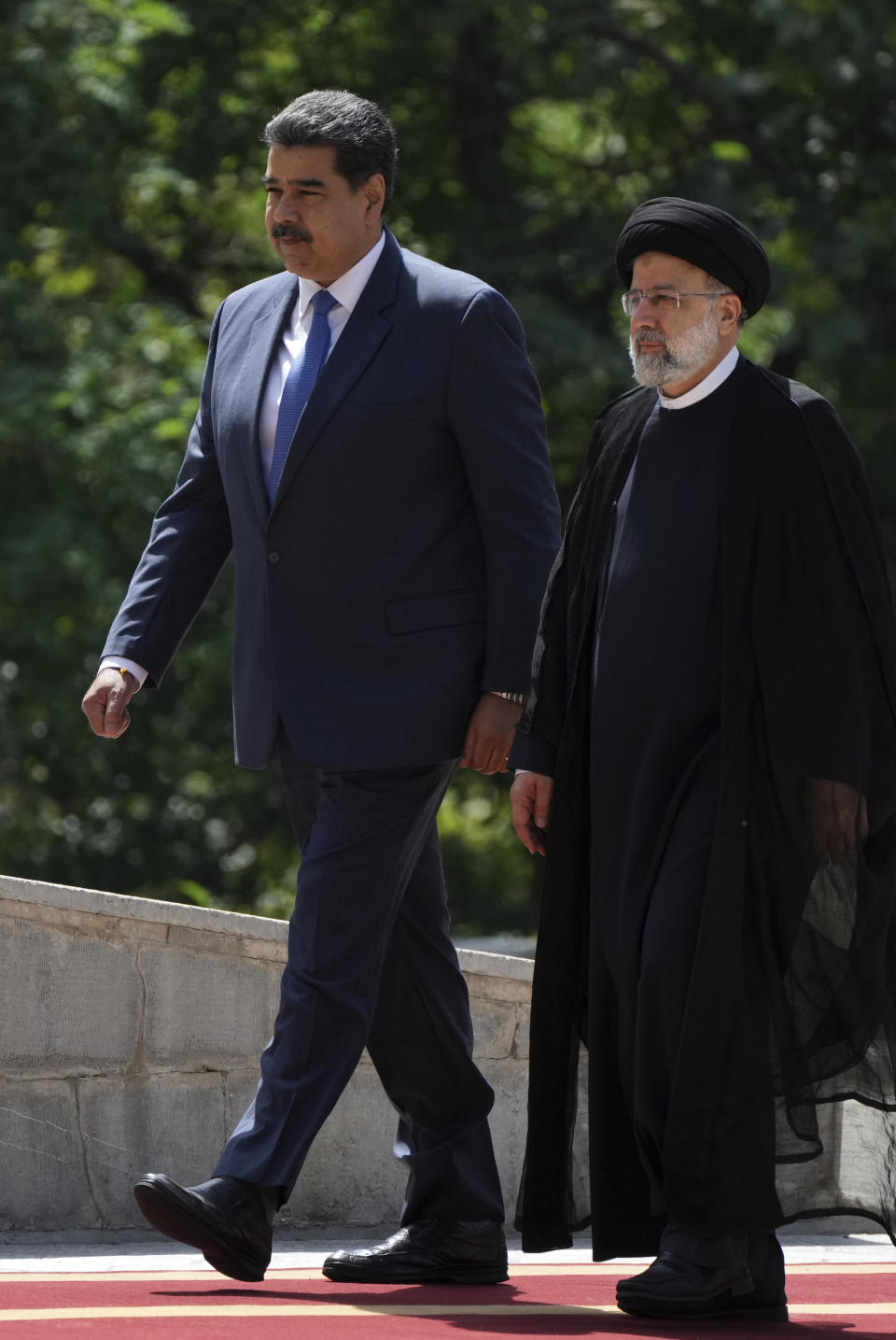 Venezuela's President Nicolas Maduro, left, is welcomed by his Iranian counterpart Ebrahim Raisi during an official welcoming ceremony at the Saadabad Palace in Tehran, Iran, Saturday, June 11, 2022. (AP Photo/Vahid Salemi)