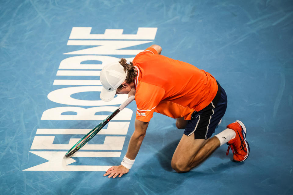 Alex de Minaur falls against Andrey Rublev.