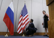 <p>A staff installs the U.S.flag next to the Russian before a news conference after a meeting between U.S. Secretary of State John Kerry and Russian Foreign Minister Sergei Lavrov in Geneva, Switzerland, Aug. 26, 2016. (Photo: Pierre Albouy/Reuters) </p>