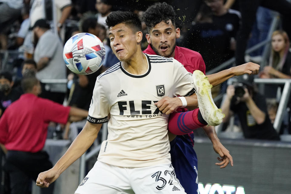 Los Angeles FC defender Marco Farfan, left, defends on Dallas FC forward Ricardo Pepi during the first half of an MLS soccer match Wednesday, June 23, 2021, in Los Angeles. (AP Photo/Marcio Jose Sanchez)