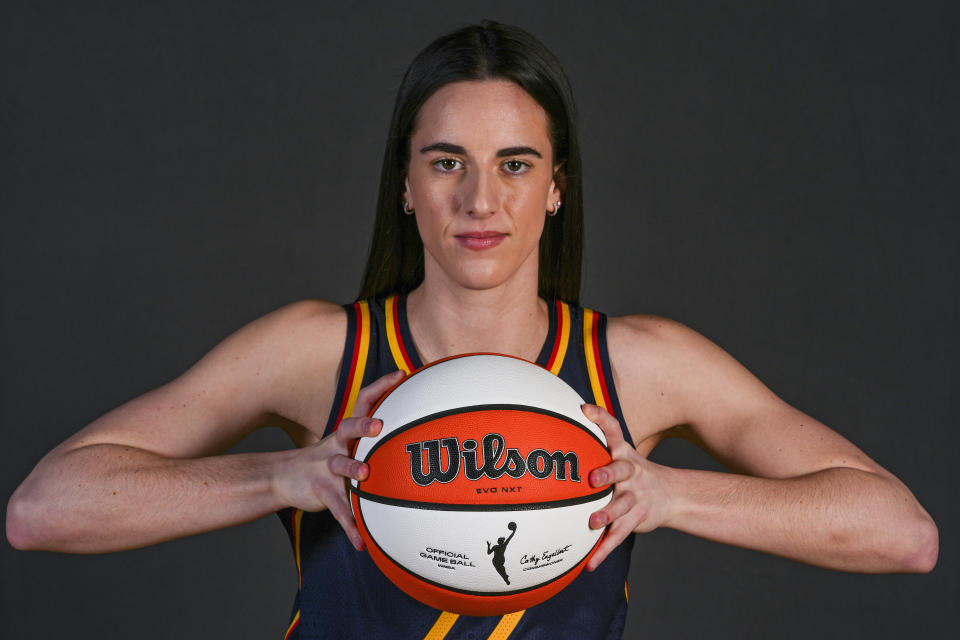 Indiana Fever guard Caitlin Clark (22) poses during WNBA basketball team's media day in Indianapolis, Wednesday, May 1, 2024. (AP Photo/Michael Conroy)