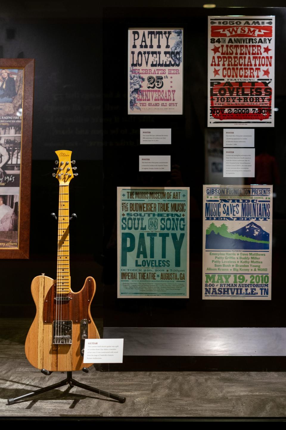 A guitar and show posters on display in the new Patty Loveless exhibit at the Country Music Hall of Fame in Nashville, Tenn., Tuesday, Aug. 22, 2023.