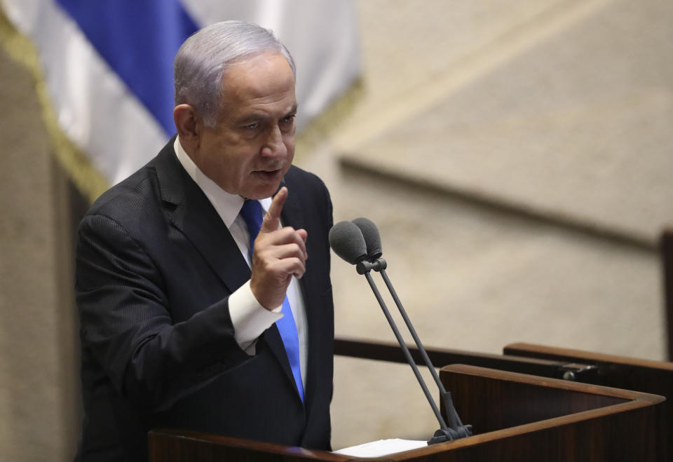 Israel's outgoing prime minister Benjamin Netanyahu speaks during a Knesset session in Jerusalem Sunday, June 13, 2021. Bennett is expected later Sunday to be sworn in as the country's new prime minister, ending Prime Minister Benjamin Netanyahu's 12-year rule. (AP Photo/Ariel Schali22