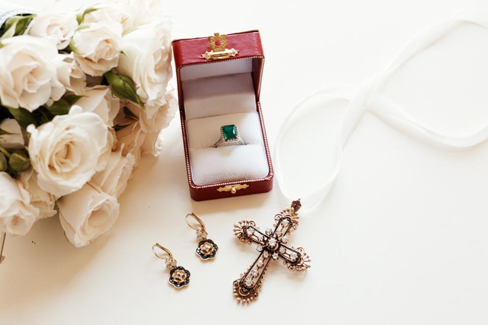 I wore my emerald engagement ring as well as earrings by Dolce & Gabbana. The antique cross was a gift from my now-husband, Topper, when our daughter, Violet, was born.