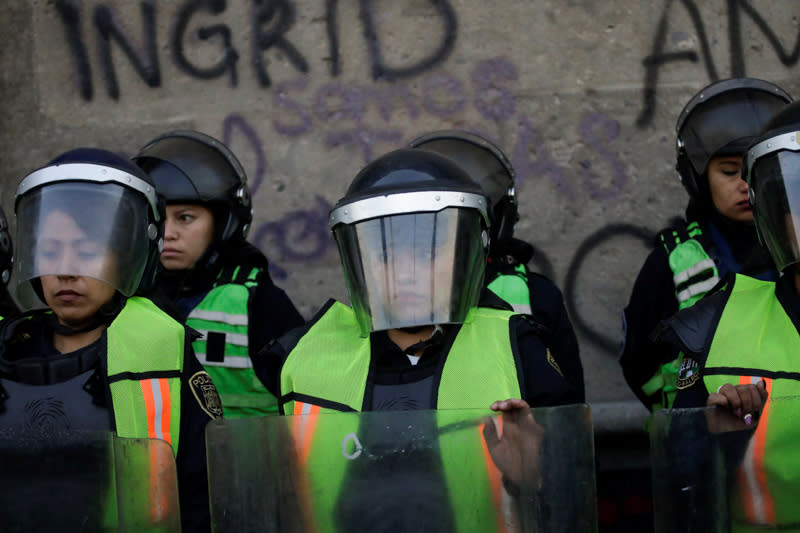 People take part in a protest against gender-based violence in downtown of Mexico City