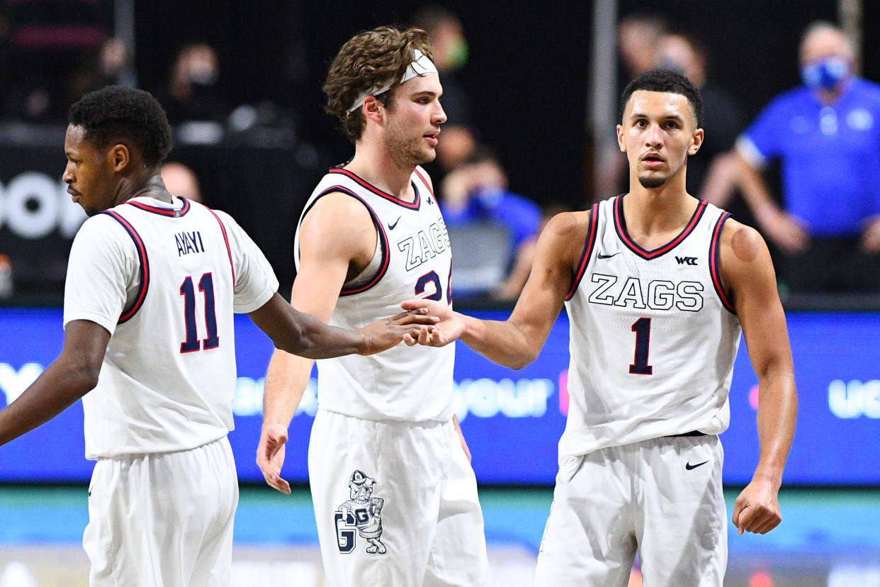 LAS VEGAS, NV - MARCH 09: Gonzaga forward Joel Ayayi (11) celebrates with Gonzaga guard Jalen Suggs (1) and Gonzaga forward Corey Kispert (24) during the championship game of the men's West Coast Conference basketball tournament between the BYU Cougars and the Gonzaga Bulldogs on March 9, 2021, at the Orleans Arena in Las Vegas, NV. (Photo by Brian Rothmuller/Icon Sportswire via Getty Images)