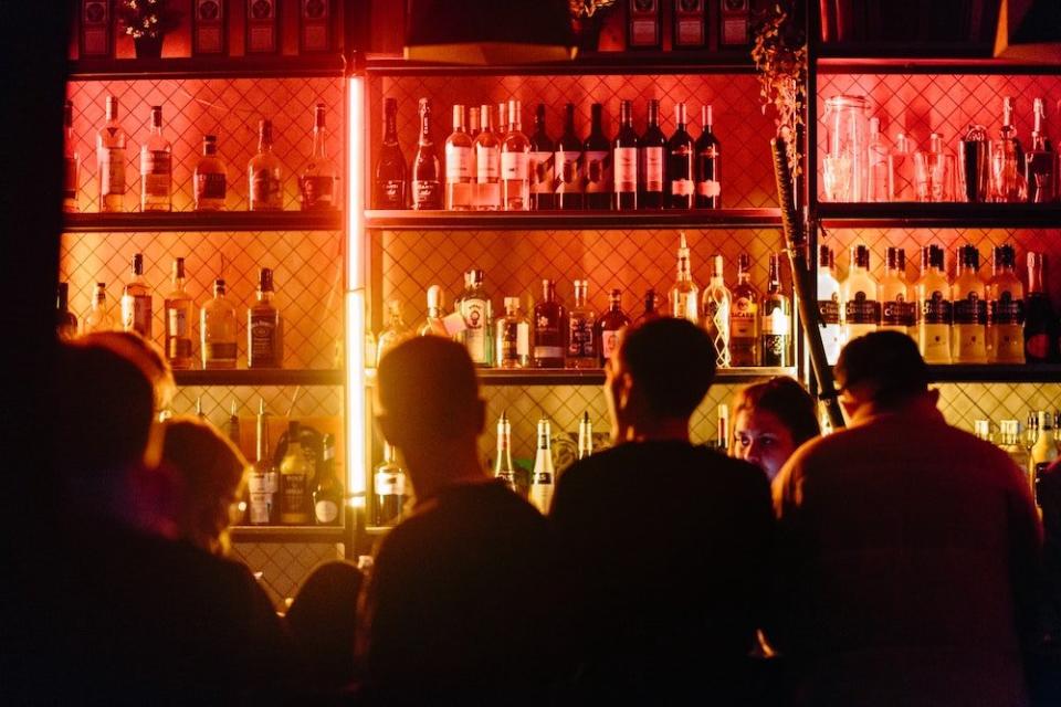 bar at night with liquor bottles