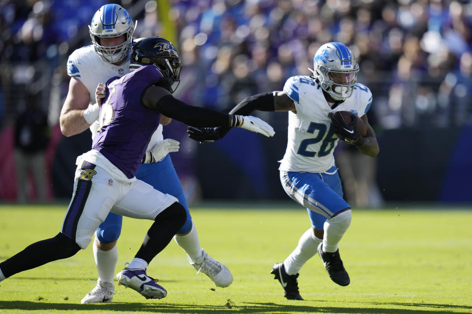 Detroit Lions running back Jahmyr Gibbs (26) rushes during the second half of an NFL football game against the Baltimore Ravens, Sunday, Oct. 22, 2023, in Baltimore. (AP Photo/Alex Brandon)