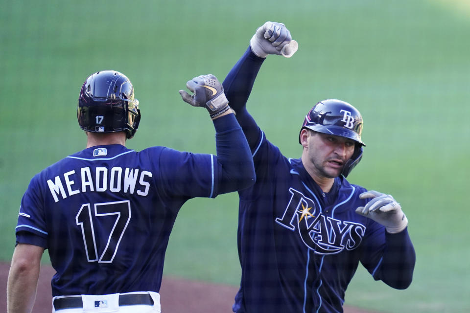 Tampa Bay Rays' Mike Zunino celebrates with Tampa Bay Rays' Austin Meadows after hitting a solo home run against Houston Astros' Lance McCullers Jr. during the seventh inning in Game 2 of a baseball American League Championship Series, Monday, Oct. 12, 2020, in San Diego. (AP Photo/Gregory Bull)