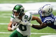 New York Jets wide receiver Braxton Berrios (10) is tackled by Indianapolis Colts cornerback Xavier Rhodes (27) in the first half of an NFL football game in Indianapolis, Sunday, Sept. 27, 2020. (AP Photo/AJ Mast)