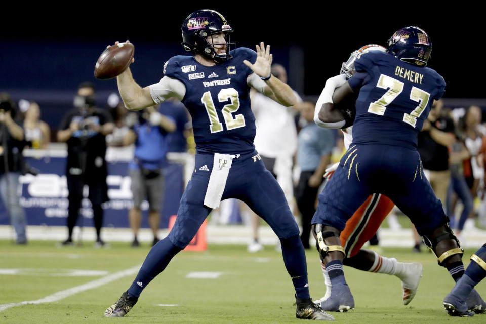 FIU quarterback James Morgan (12) stands back to pass during the first half of an NCAA college football game against Miami, Saturday, Nov. 23, 2019, in Miami. (AP Photo/Lynne Sladky)