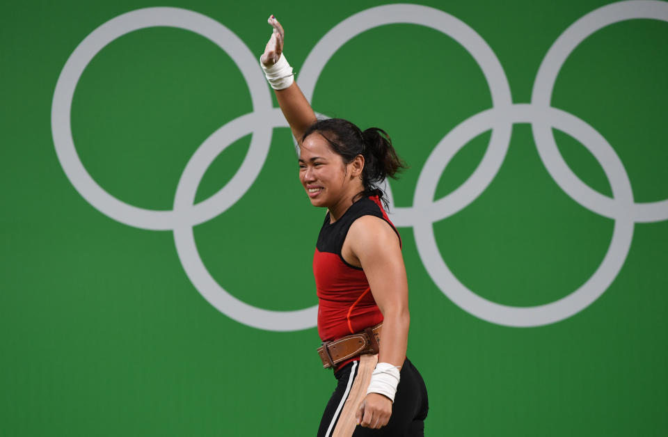 Philippines' Hidilyn Diaz celebrates during the women's 53kg weightlifting event at the Rio 2016 Olympic games in Rio de Janeiro on August 7, 2016. / AFP / GOH Chai Hin        (Photo credit should read GOH CHAI HIN/AFP via Getty Images)