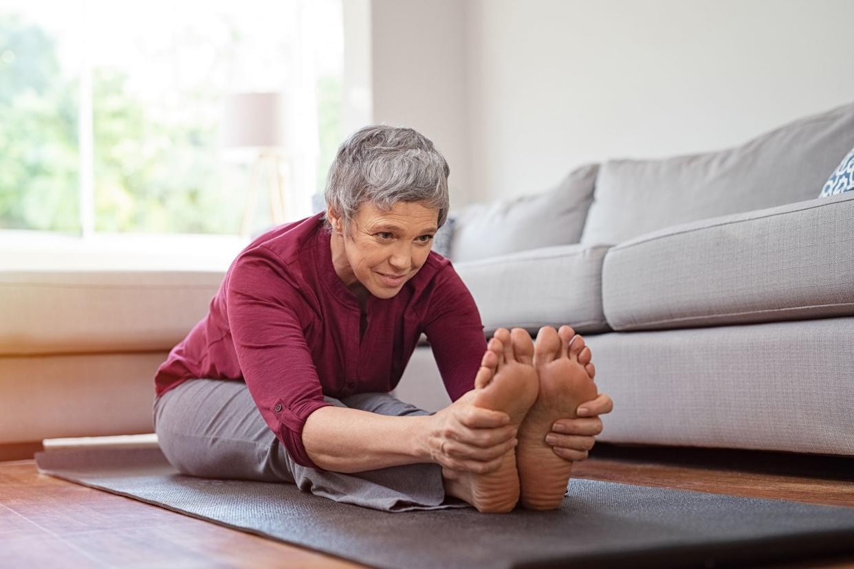 stretching senior woman