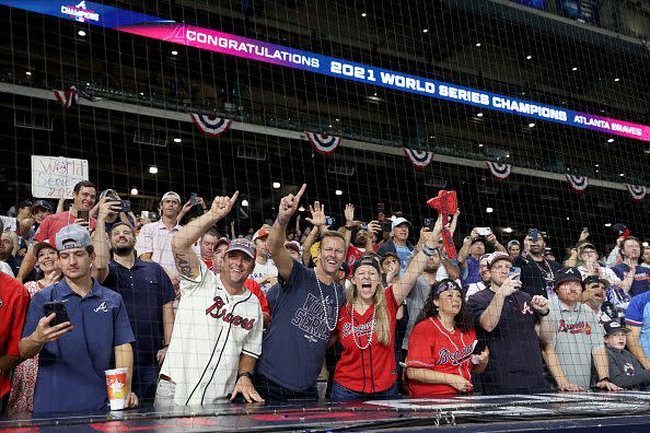 HOUSTON, TEXAS - NOVEMBER 02:  Fans celebrate the Atlanta Braves 7-0 victory against the Houston Astros in Game Six to win the 2021 World Series at Minute Maid Park on November 02, 2021 in Houston, Texas. (Photo by Elsa/Getty Images)