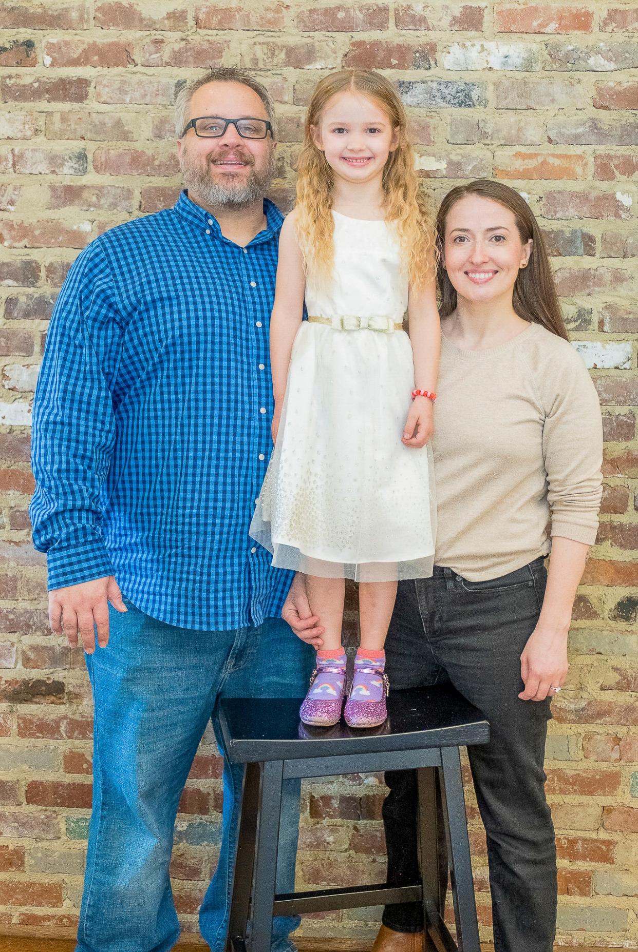 Ryan, Libby and Sarah Nelson love their new home.