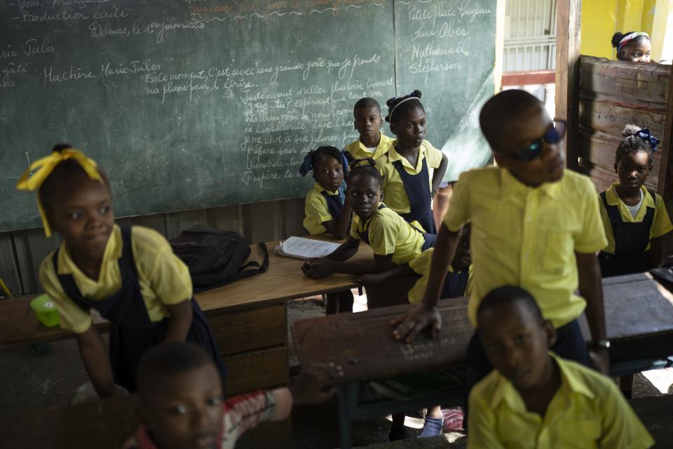 Students wait in their classroom for their teacher to arrive at the Institution Mixte Wesleyenne Regard Divin school, in Port-au-Prince, Haiti, June 1, 2023. (AP Photo/Ariana Cubillos)