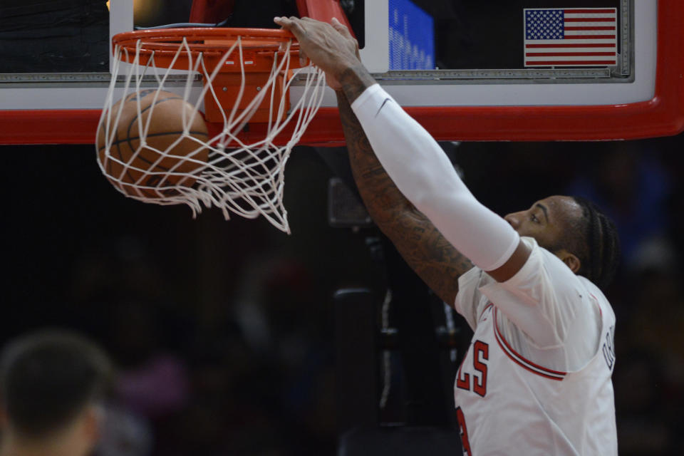 Chicago Bulls' Andre Drummond, right, dunks during the first half of an NBA basketball game against the San Antonio Spurs, Monday, Feb. 6, 2023, in Chicago. (AP Photo/Paul Beaty)