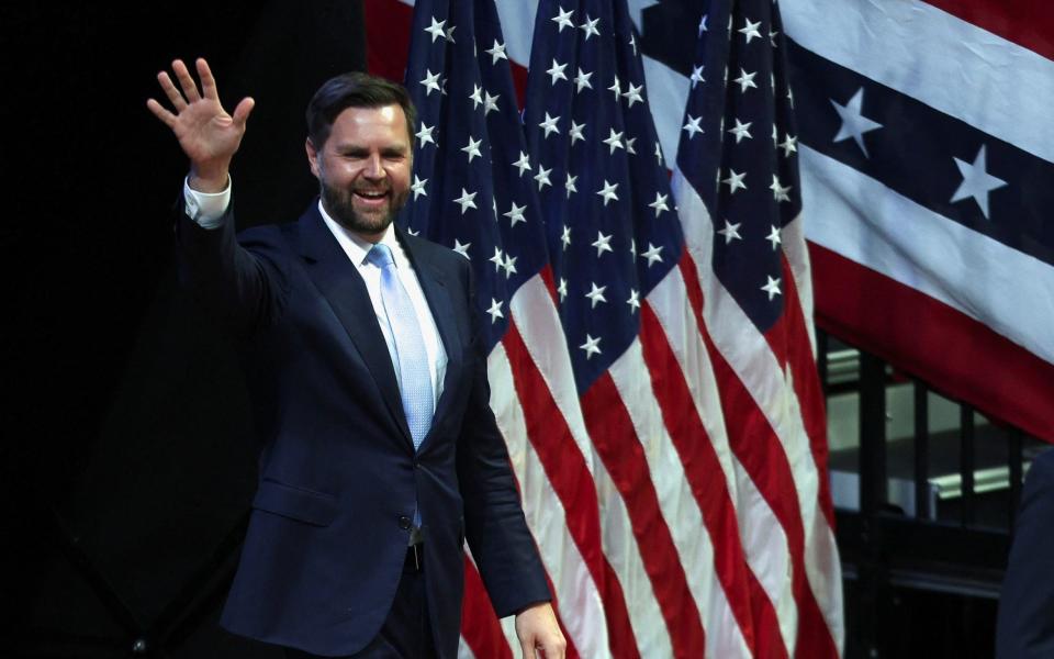 JD Vance waves during his first rally as Republican presidential nominee