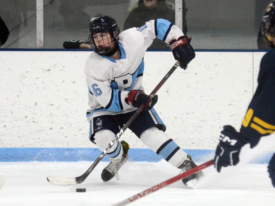 Petoskey's Wyatt Stinger puts the breaks on while looking for a teammate to pass to during the first period.