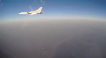 A still image, taken from video footage and released by Russia's Defence Ministry on August 18, 2016, shows a Russian Tupolev Tu-22M3 long-range bomber based at Iran's Hamadan air base dropping off bombs at Islamic State and Nusra Front targets according to the ministry, in the Syrian province of Deir ez-Zor. Ministry of Defence of the Russian Federation/Handout via REUTERS TV