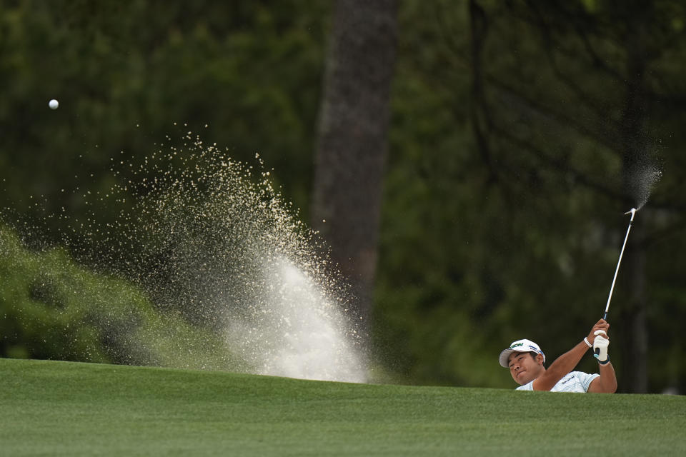 Hideki Matsuyama, of Japan, hits out of a bunker on the first hole during the third round of the Masters golf tournament on Saturday, April 10, 2021, in Augusta, Ga. (AP Photo/Matt Slocum)