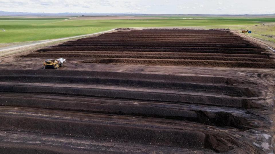 The city of Boise’s Twenty Mile South Farm uses windrow composting — long rows of compost piles that are then turned by a large machine to mix in oxygen.