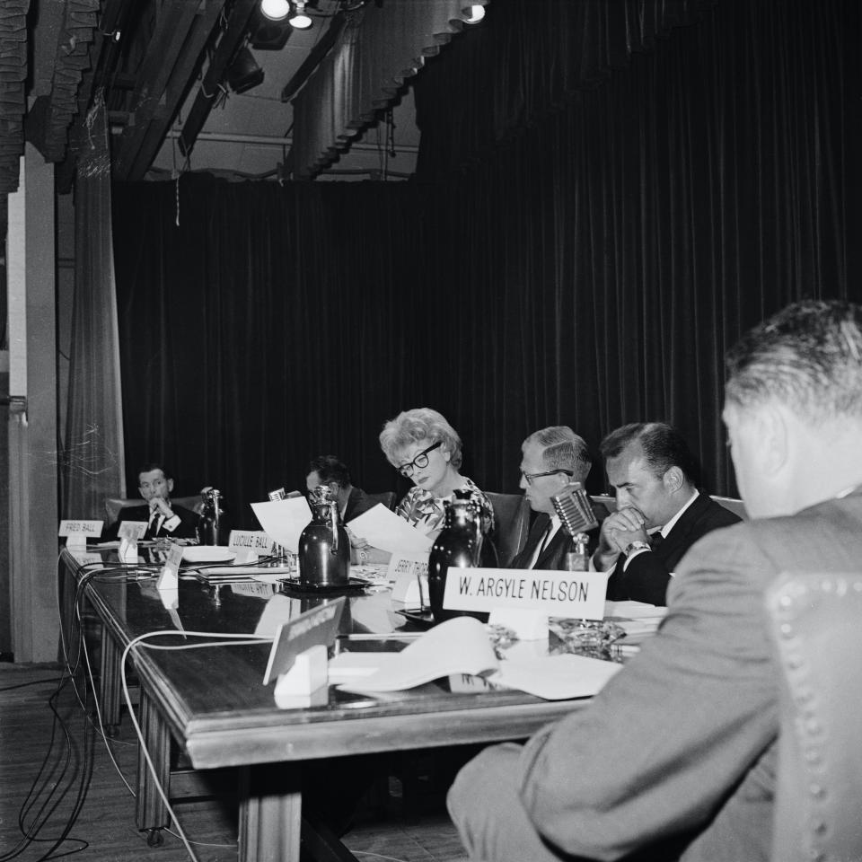 Lucille Ball sitting down reading