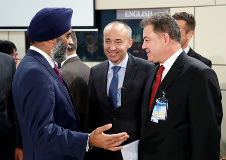 Canada's Defence Minister Harjit Sajjan talks to his Bulgarian counterpart Nikolay Nenchev (R) during a NATO defence ministers meeting at the Alliance headquarters in Brussels, Belgium, October 26, 2016. REUTERS/Francois Lenoir