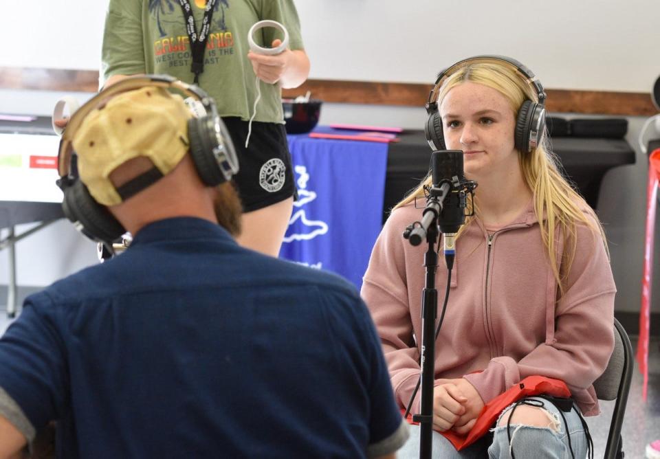 A student takes part in a podcast recording with Michael W. Wilson II, a Licensed Professional Counseling with The Wellness Project.