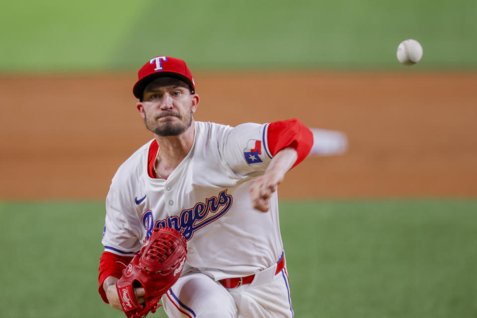 Texas Rangers pitcher Andrew Heaney delivers during the first inning of a baseball game against the Houston Astros, Monday, April 8, 2024, in Arlington, Texas. (AP Photo/Gareth Patterson)