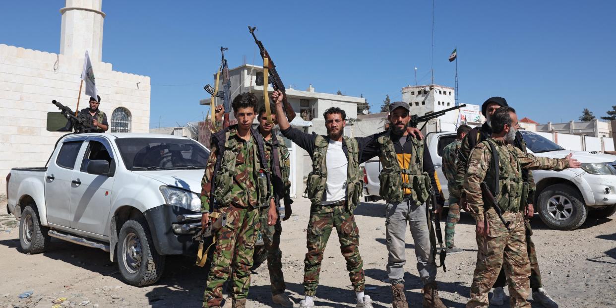 ighters from the Turkish-backed Free Syrian Army are deployed on a checkpoint in the area of Kafr Jannah on the outskirts of the Syrian town of Afrin on October 19, 2022.