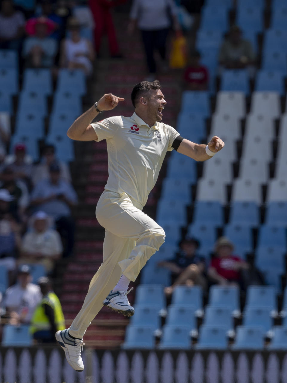 England's bowler James Anderson jumps as he celebrates after dismissing South Africa's batsman Dean Elgar for a duck on day one of the first cricket test match between South Africa and England at Centurion Park, Pretoria, South Africa, Thursday, Dec. 26, 2019. (AP Photo/Themba Hadebe)