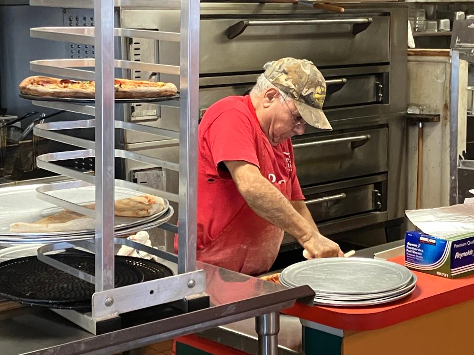 Tony Dimeo cuts a pizza at Ciro's in Verona. The Dimeo family is retiring at the end of the year and Ciro's is being sold. It will remain a pizza restaurant under new ownership.