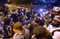 <p>Protesters confront Charlotte-Mecklenburg police officers at the intersection of Church Street Saturday, Sept. 24, 2016, in Charlotte, N.C. (Jeff Siner/The Charlotte Observer via AP)</p>