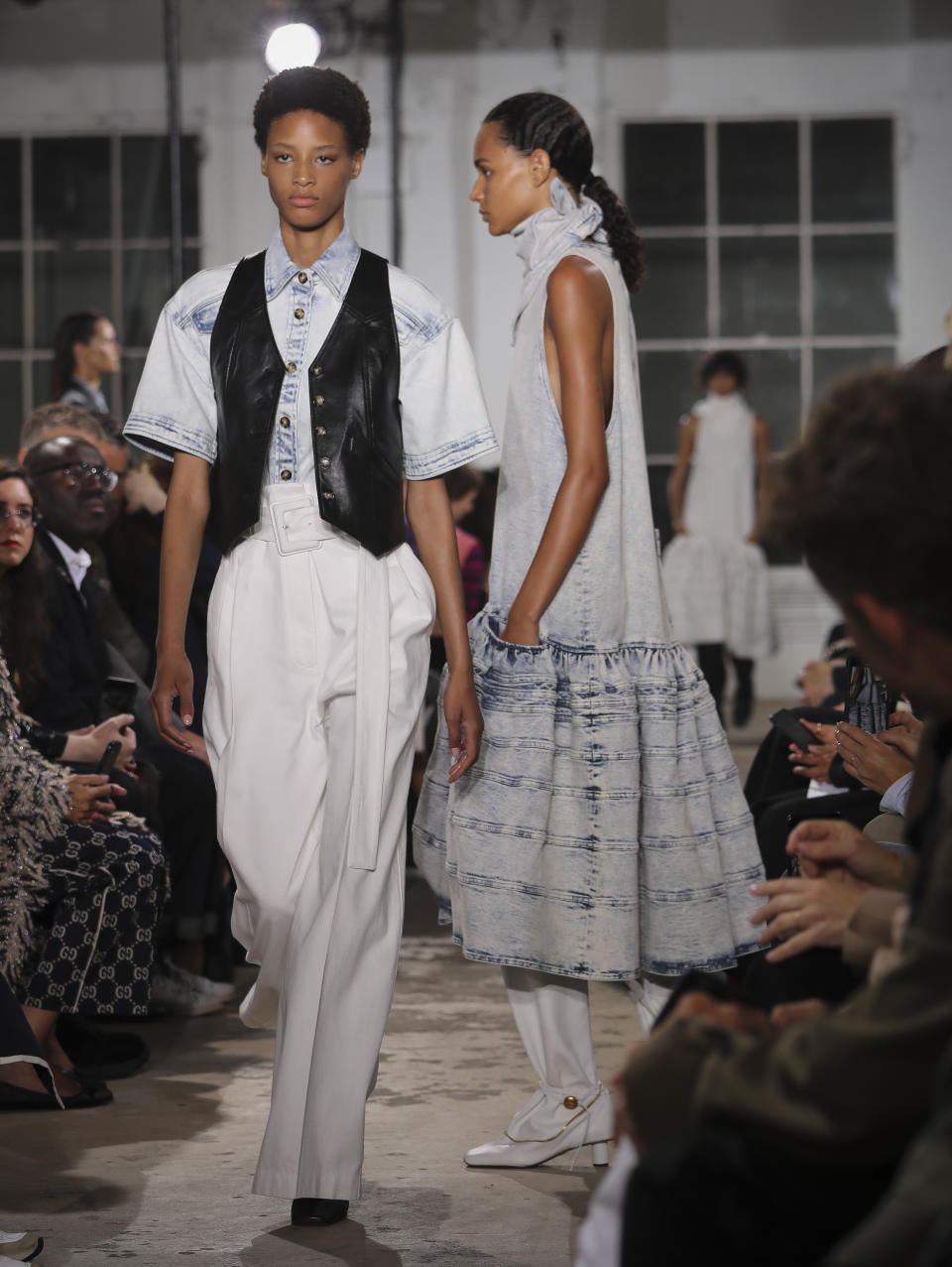 Fashion from the Proenza Schouler collection is modeled during Fashion Week, Monday Sept. 10, 2018 in New York. (AP Photo/Bebeto Matthews)