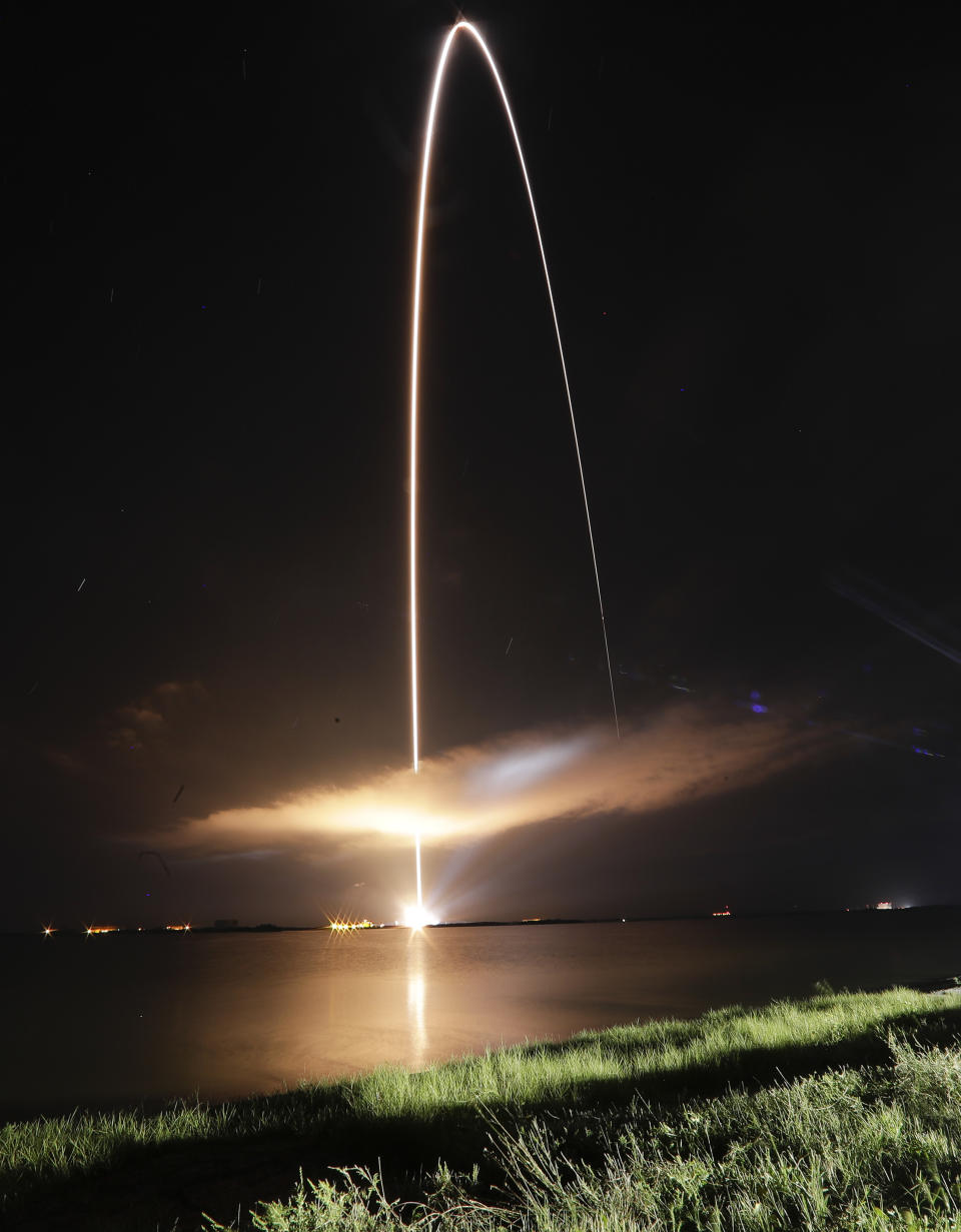 A Delta IV rocket, carrying the Parker Solar Probe, lifts off from launch complex 37 as seen during a time exposure at the Kennedy Space Center, Sunday, Aug. 12, 2018, in Cape Canaveral, Fla. The Parker Solar Probe will venture closer to the Sun than any other spacecraft and is protected by a first-of-its-kind heat shield and other innovative technologies that will provide unprecedented information about the Sun. (AP Photo/John Raoux)