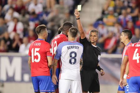 Sep 1, 2017; Harrison, NJ, USA; Referee John Pitti issues a yellow card to United States forward Clint Dempsey (8) during the second half against Costa Rica at Red Bull Arena. Vincent Carchietta-USA TODAY Sports